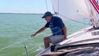 Offshore Sailing School  Adjusting the Fairlead on the Loaded Jib Sheet [upl. by Aierb]