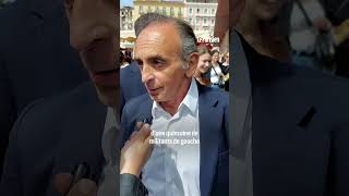 Eric Zemmour frappe une femme qui vient de lui jeter un œuf sur un marché en Corse [upl. by Brownson627]