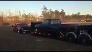 Bagged OBS Chevy Dually Towing Double Car Hauler [upl. by Hairas]