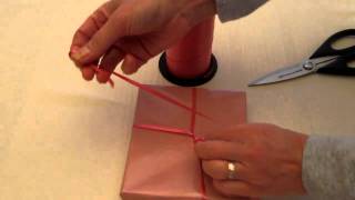 How To Tie A Ribbon On A Gift Part 1 [upl. by Xam281]