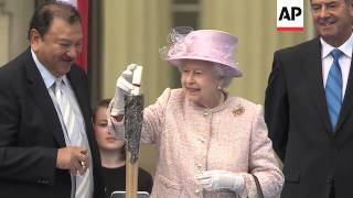 Queen Elizabeth II places message to the Commonwealth Games inside baton [upl. by Ahsinyar]