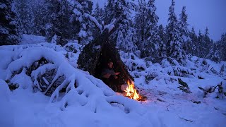 Solo Winter Bushcraft  Heavy Snowfall  Shelter building amp Overnight at the Campfire [upl. by Nnylorac430]