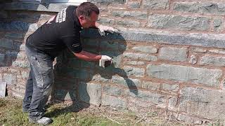 Finishing lime mortar off using a piece of wood then a churn brush [upl. by Harrat]