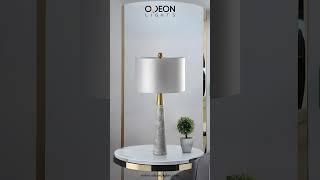 Elegant table lamp with a sleek marble base and gold accents bulb [upl. by Yenetruoc969]