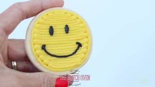 How to frost a smiley face in buttercream frosting [upl. by Mckee]