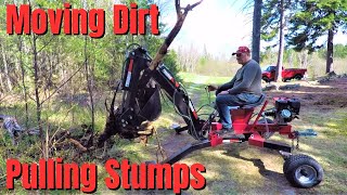 Using my Red RockTrencherman mini Towable backhoe from Princess Auto to dig and move stumps [upl. by Leler]