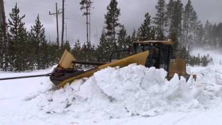 Plowing snow from roads in the spring in Yellowstone National Park [upl. by Ayanet20]