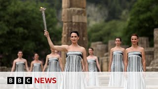 Olympic flame lit in Greeces ancient Olympia  BBC News [upl. by Ettennal]