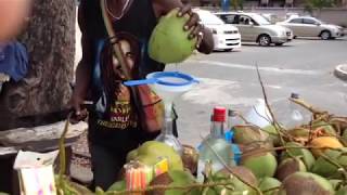 Fresh coconut water from a guy with all ten of his fingers [upl. by Anekam]