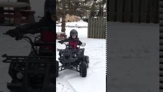 5 yr old doing doughnuts in snow on TaoTao TForce 110cc quad [upl. by Salangia]