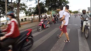 Crossing the road in Ho Chi Minh City Vietnam [upl. by Hnim]