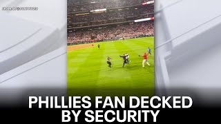 WATCH Phillies fan leveled by security after running onto field [upl. by Thorstein]