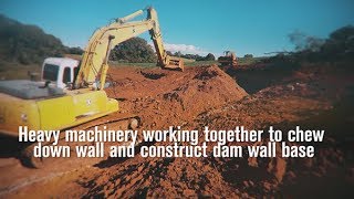 20 ton excavator 14 ton excavator amp D7 bulldozer chewing down wall for dam base [upl. by Goodden75]