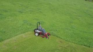 Exmark Lazer Z Mowing Tall Grass Drone Video By QUE Sales Inc [upl. by Arretnahs]