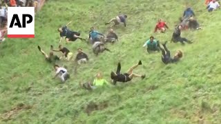 WATCH Englands annual cheese rolling race [upl. by Brita440]