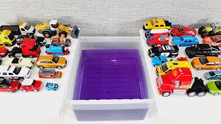 Diecast Model Cars Sliding Into The Purple Water [upl. by Silrac]