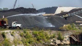 Mounds of pet coke seen along Calumet River [upl. by Enaht184]