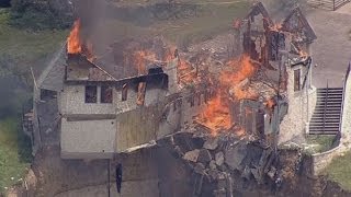 Burning down the house Texas family burn down luxury home that hangs over 75ft cliff [upl. by Aleron325]