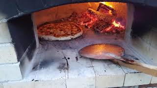 Homemade pizza from a woodburning oven Vermiculite pizza oven Subscribe to see more pizza videos [upl. by Liahus846]