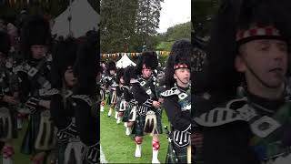 Lonach Highlanders led by Pipe Band marching during 2019 Lonach Highland Games in Scotland shorts [upl. by Gnourt928]