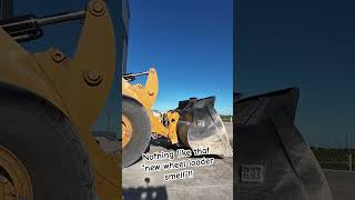 Nothing like that new machine smell cat wheelloader concrete [upl. by Aznofla]