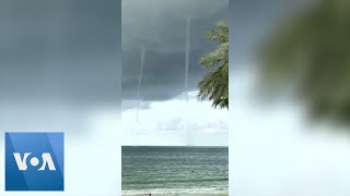 Multiple Waterspouts Rise Near Florida Beach [upl. by Latreshia]