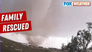 HURRY GET INSIDE Storm Chaser Rescues Family During Large Tornado [upl. by Calder205]