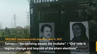 Iranian people boycott Iran election and install posters of Maryam Rajavi [upl. by Mayce657]