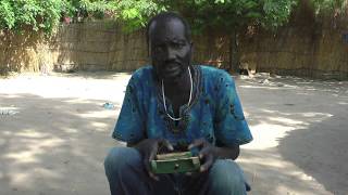 Opiew playing the Anywaa lamellophone Ethiopia [upl. by Ardnuek]