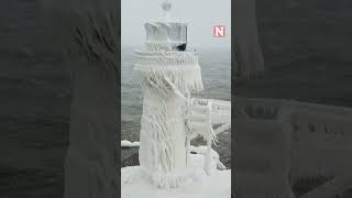 Winter Storm Covers Historic Lake Michigan Lighthouse In Ice [upl. by Johm]