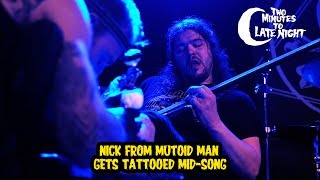 Nick From Mutoid Man Gets Tattooed MidSong [upl. by Aylad610]