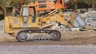 DOZER CATERPILLAR 973B LOADING TRUCKS WITH DEMOLITION DIRT BULLDOZER EXCAVATOR [upl. by Lemraj428]