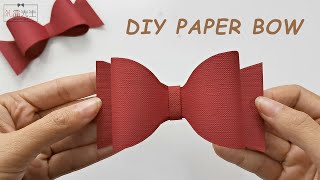 How to make a paper bow out of gift wrapping paper  Origami bow tie tutorial [upl. by Cole]