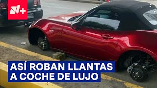 Así quita pareja de ladrones tres llantas a un auto de lujo  N [upl. by Anilas]