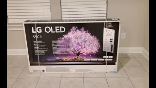 LG OLED C1 Unboxing Assemble Setup and First Impressions [upl. by Harle]