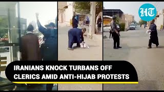 Iranians knock turbans off clerics as Hijab protesters defy Islamic guards ultimatum  Viral [upl. by Adnilema]