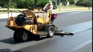 SealMaster Sealcoating Liquid Road Asphalt Pavement Sealer on Parking Lot [upl. by Euqnimod573]