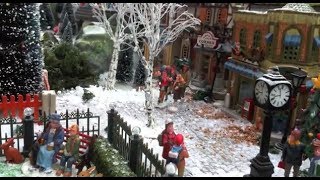 Christmas Village Displays  with Lemax houses Department 56 models trees snowmen and figurines [upl. by Aneehsram]