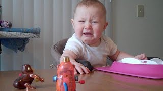 Baby is freaked out by monkey toy  Babies and Toddlers  KYOOT [upl. by Ahsitan]